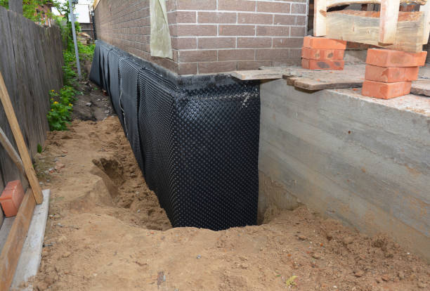 SJ Waterproofing Pros technician performing targeted Vapor Barrier Installation assessment in Baldwin, MI